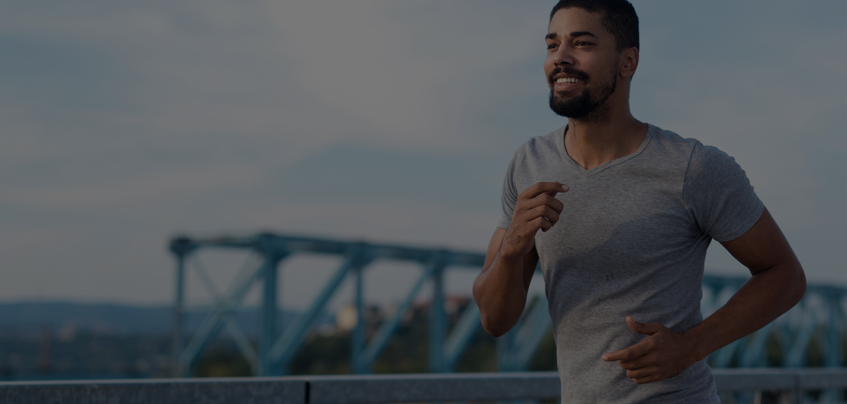 A happy man is jogging